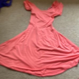 This is a pink colored dress with an open back only worn one time for Halloween